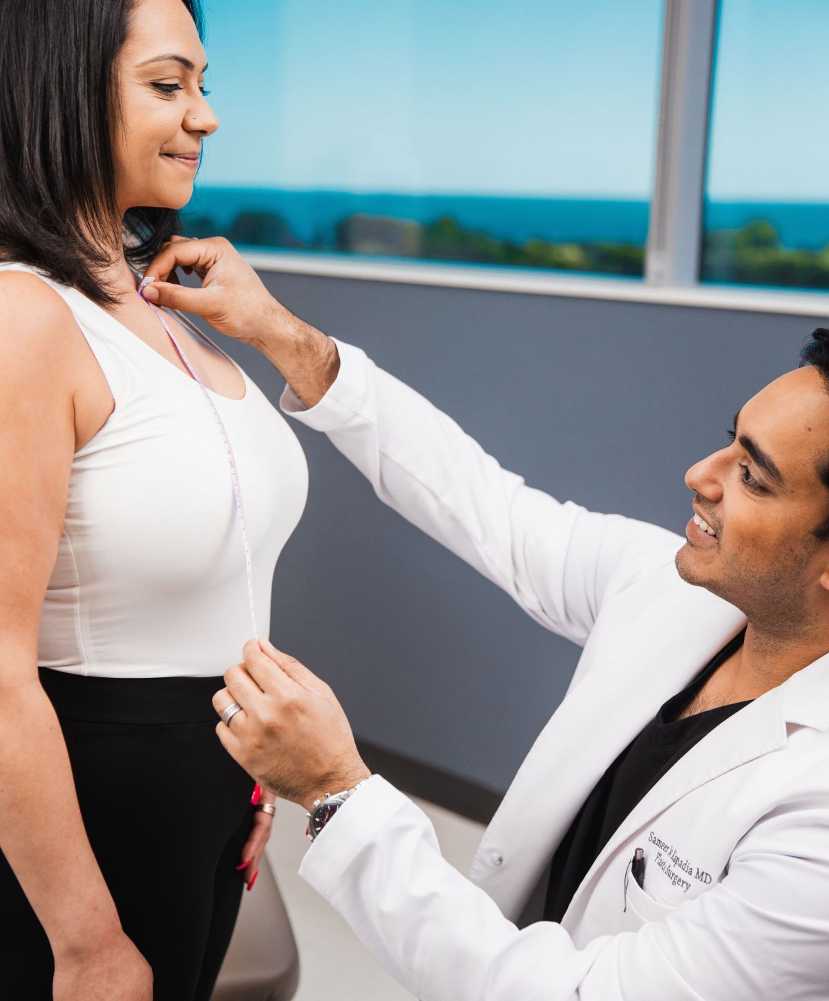 chicago breast augmentation surgeon, Dr. Kapadia, meeting with a breast implant patient