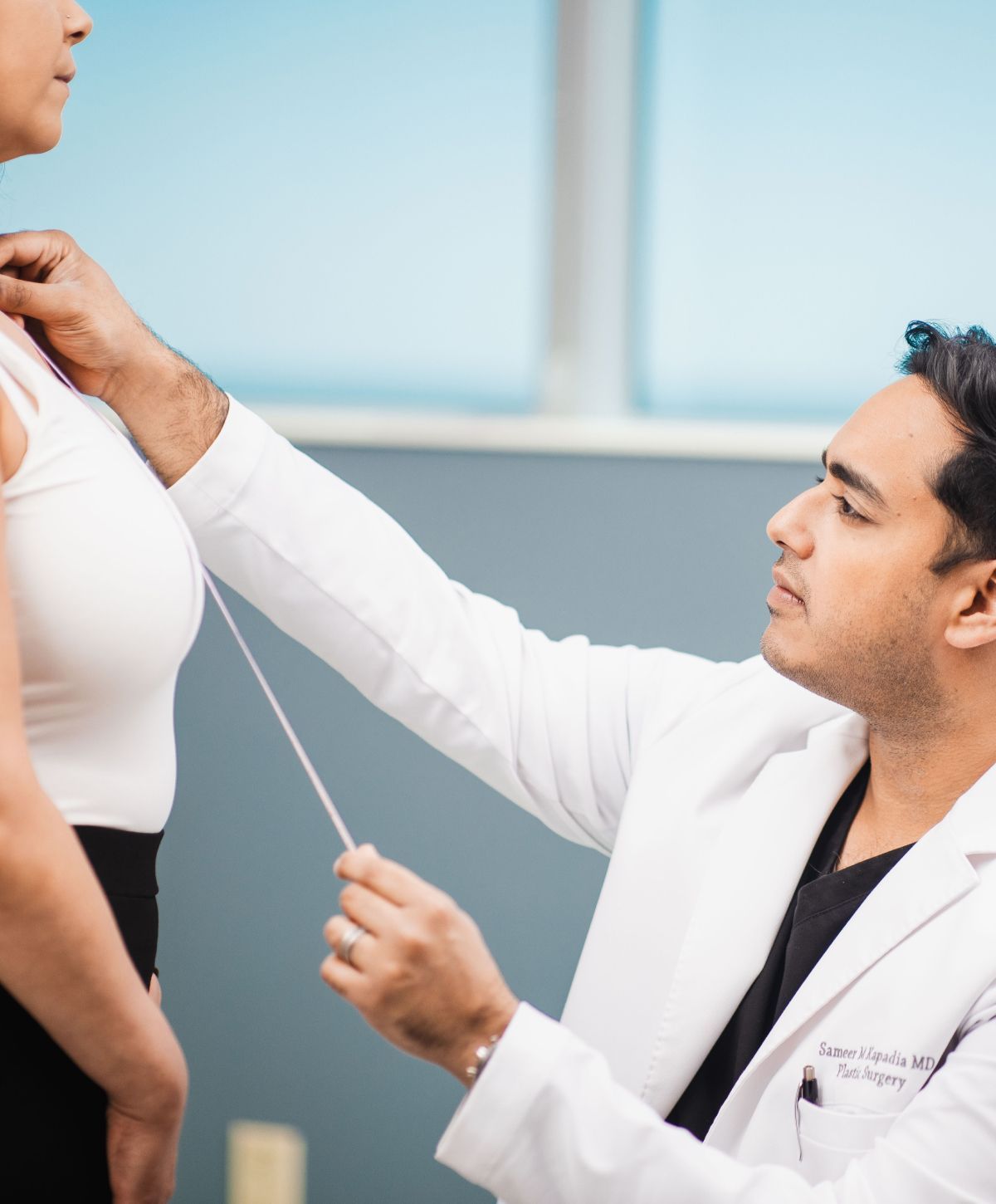 chicago breast lift surgeon, Dr. Kapadia, meeting with a patient