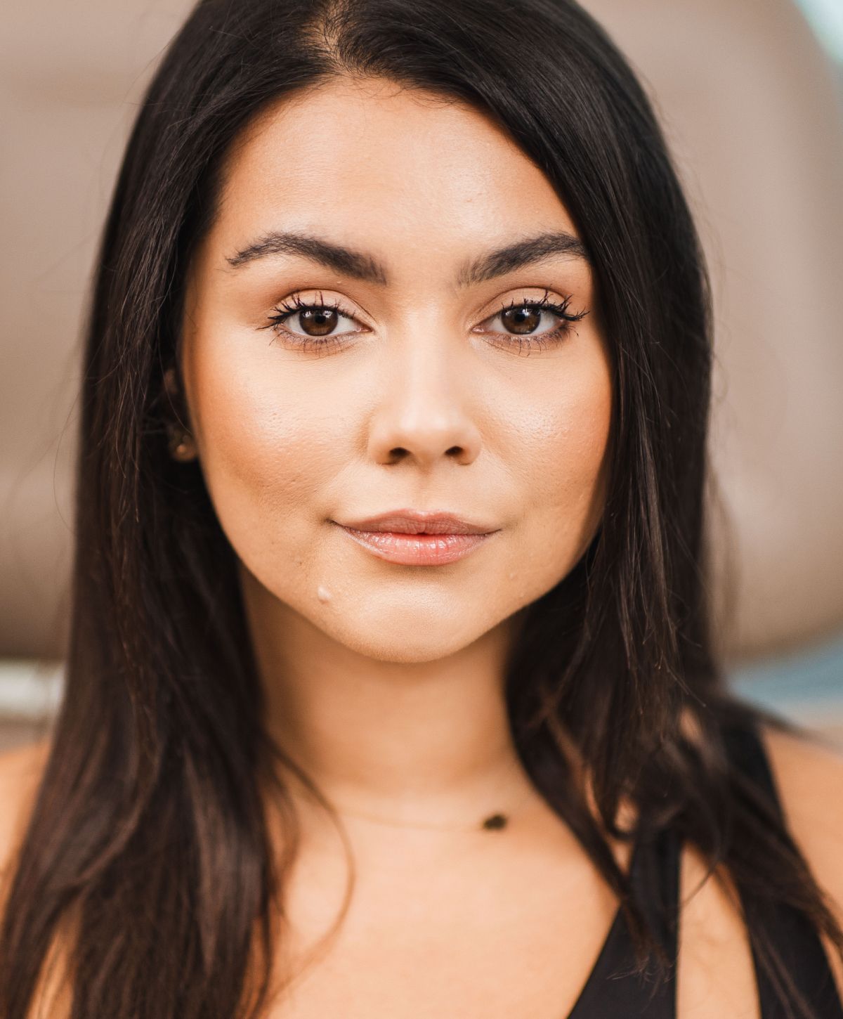 Close-up portrait of a woman with long hair.