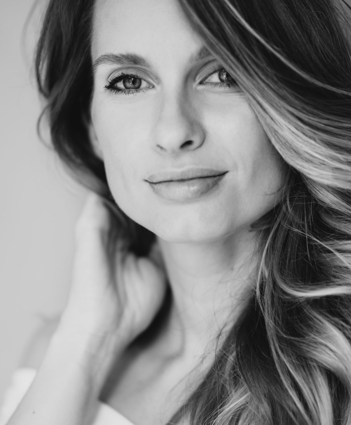 Black and white portrait of woman with wavy hair